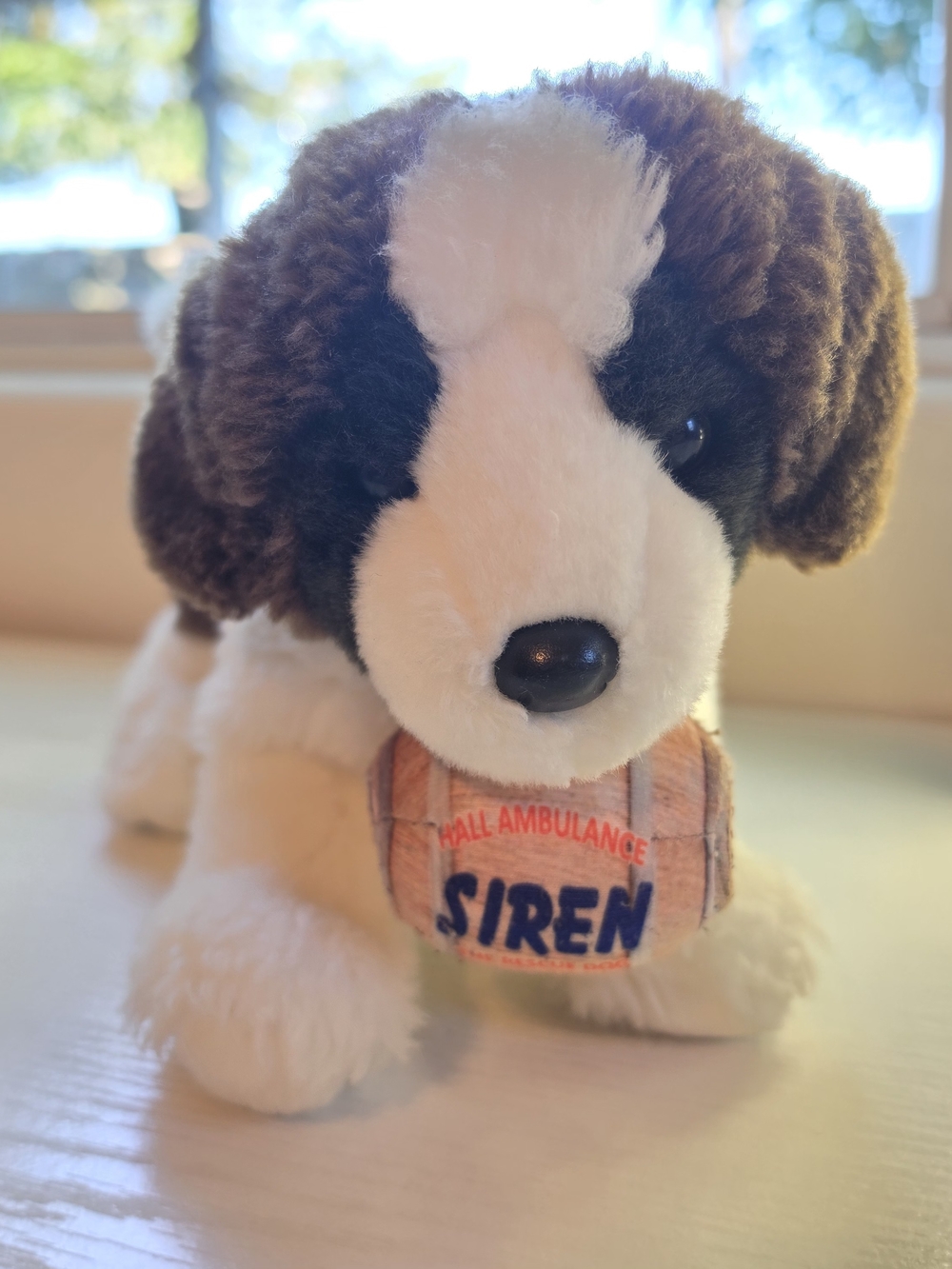 Brown and White Saint Bernard Plush Toy with Barrel Accent
